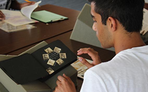 Image of student reviewing archival material