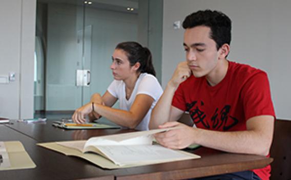 Image of students researching in the archive