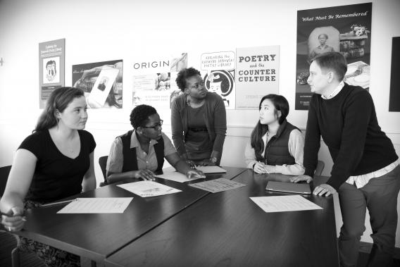 Donna Troka (standing at left), American Studies adjunct assistant professor, and Gabrielle Dudley, Rose Library instruction archivist and QEP librarian, help students in Troka’s "Resisting Racism" spring semester class work with the library’s civil rights collections. Emory Photo/Video.