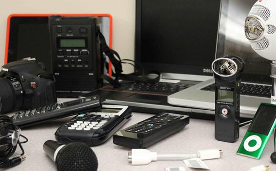 An assortment of equipment available for loan from Emory Libraries, including DSLR cameras, audio recorders, and microphones