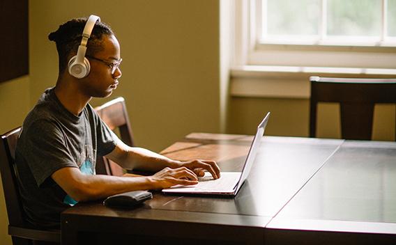 Student on a laptop in the Matheson Reading Room