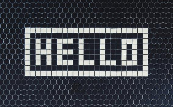 Black and white tiles spelling out "Hello"