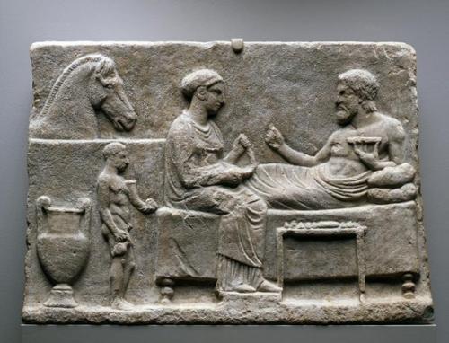 Photo Caption: Votive Relief with Banquet Scene, Greek, 4th Century BCE, Carlos Collection of Ancient Art